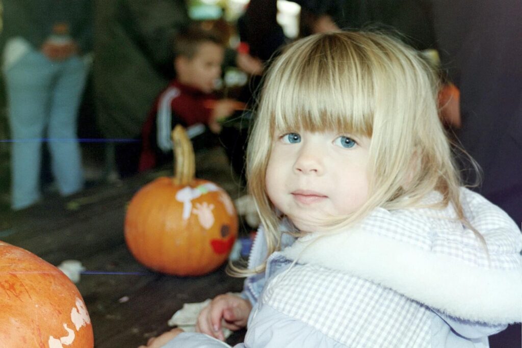 Rachel painting pumpkins